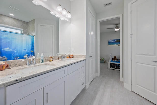 bathroom with a shower with curtain, ceiling fan, hardwood / wood-style floors, and vanity