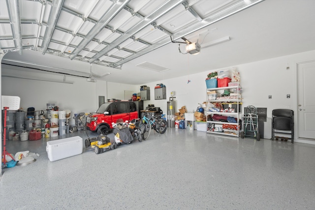 garage with a garage door opener and gas water heater