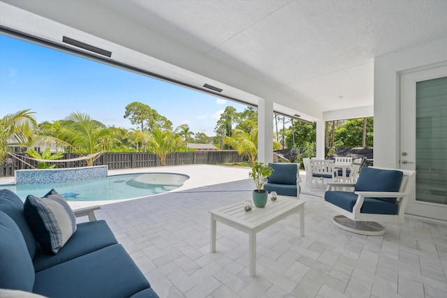 view of swimming pool featuring a patio area