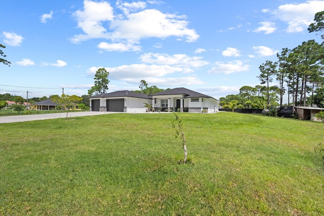 ranch-style house with a front lawn and a garage