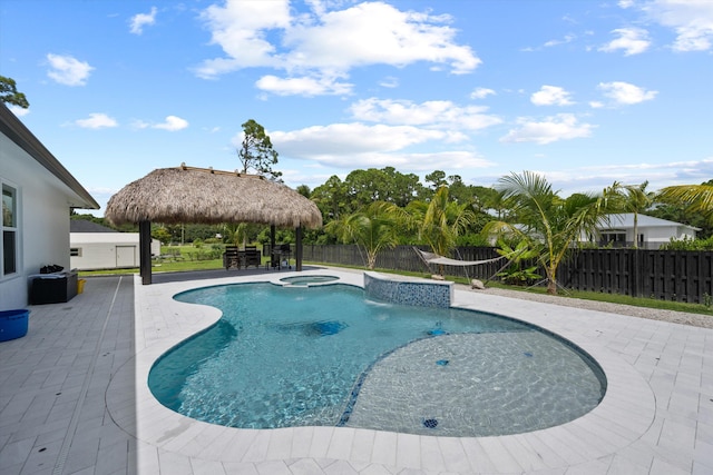 view of pool featuring a gazebo, a patio, and an in ground hot tub