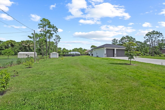 view of yard with a garage