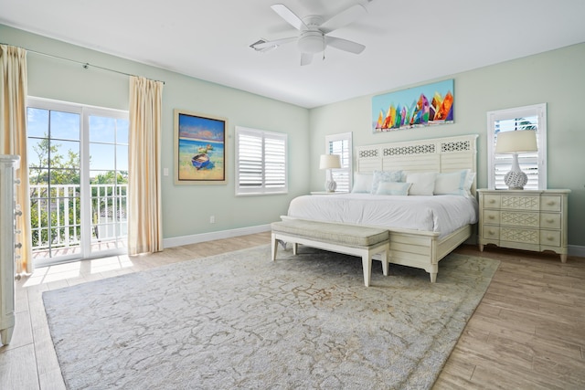 bedroom with ceiling fan, light hardwood / wood-style flooring, and access to outside