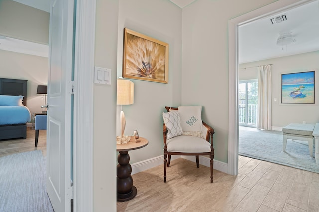 living area with light hardwood / wood-style floors