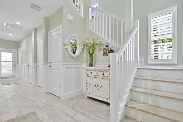 staircase featuring a wealth of natural light