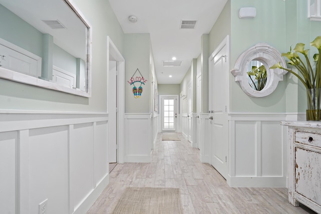 hallway featuring light hardwood / wood-style flooring