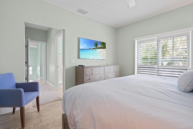 bedroom with ceiling fan and light hardwood / wood-style floors