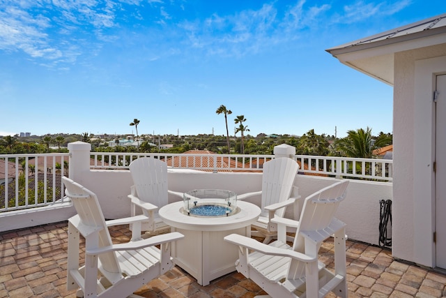 view of patio with a fire pit