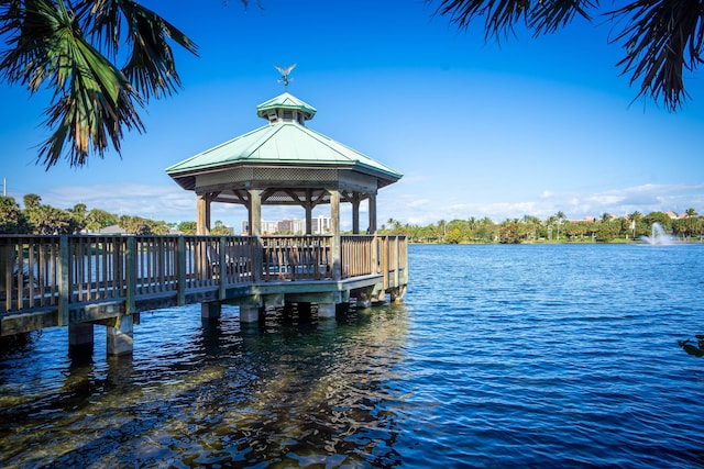 view of dock with a water view and a gazebo