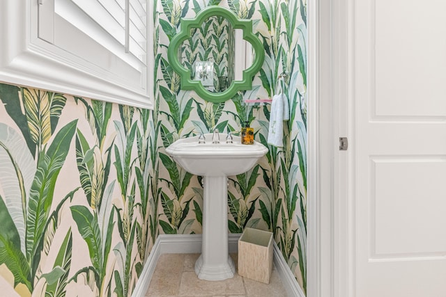 bathroom featuring wallpapered walls, tile patterned flooring, and baseboards