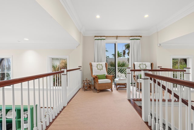 hall with ornamental molding, recessed lighting, carpet floors, and an upstairs landing