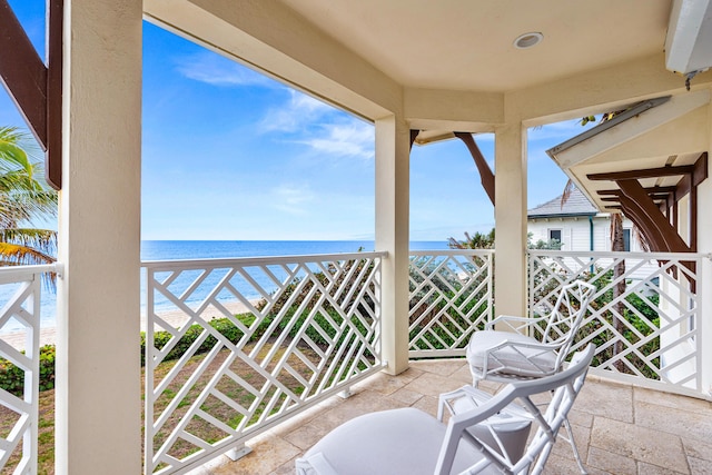 balcony featuring a water view