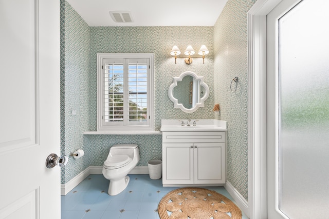 bathroom with baseboards, visible vents, toilet, and wallpapered walls