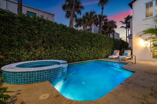 view of pool with a pool with connected hot tub and a patio