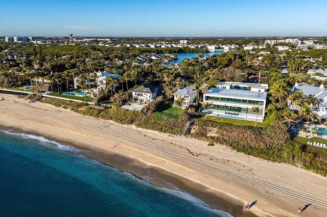 aerial view with a water view and a beach view