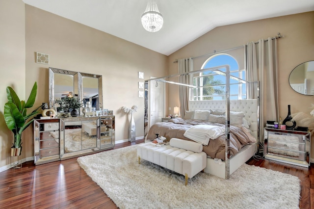 bedroom with an inviting chandelier, lofted ceiling, and dark hardwood / wood-style floors