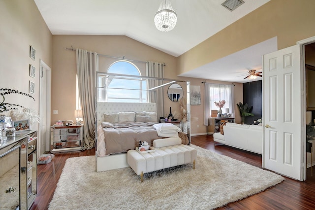 bedroom featuring ceiling fan with notable chandelier, lofted ceiling, and dark hardwood / wood-style floors