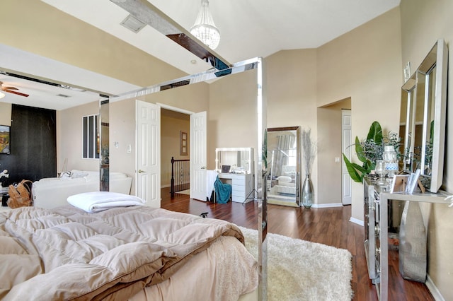 bedroom with dark hardwood / wood-style floors