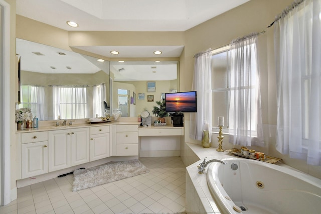 bathroom featuring lofted ceiling, vanity, tile patterned flooring, and tiled tub