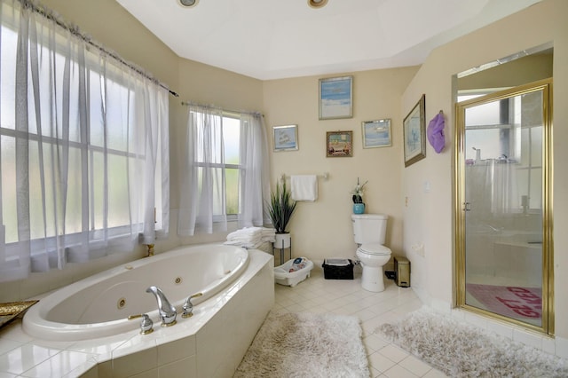 bathroom with toilet, plus walk in shower, and tile patterned floors