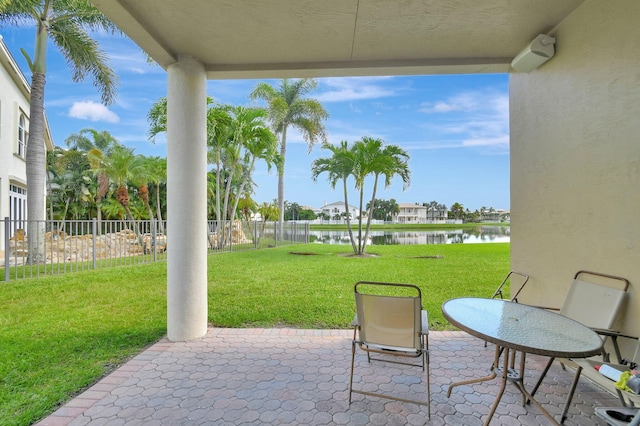 view of patio featuring a water view