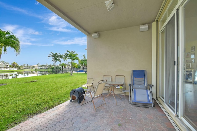 view of patio featuring a water view