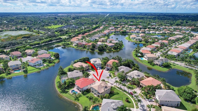 birds eye view of property with a water view