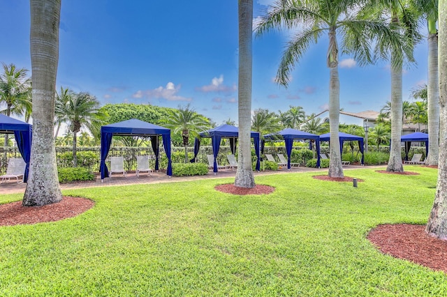 surrounding community featuring a gazebo and a lawn