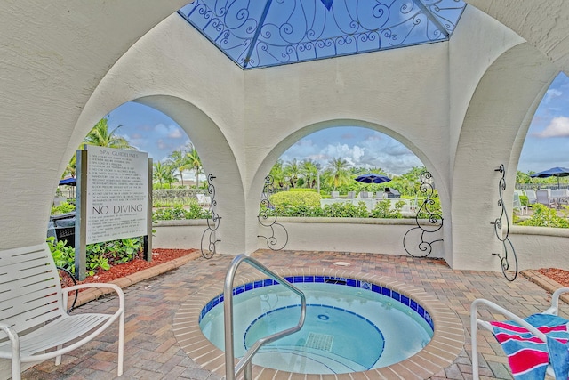 view of pool featuring a hot tub