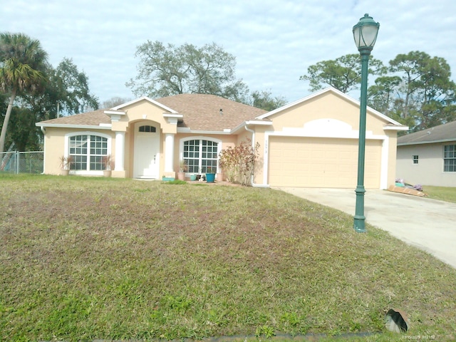 single story home with a front lawn and a garage