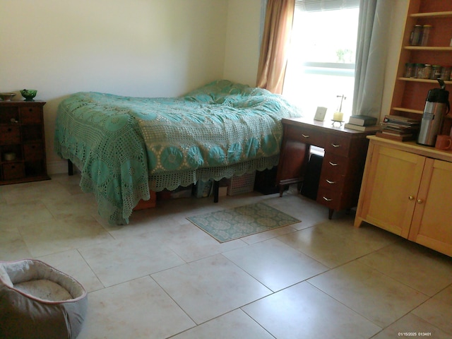 bedroom featuring light tile patterned flooring