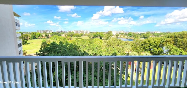 balcony with a water view and a city view