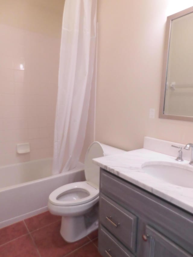 full bathroom with toilet, vanity, tile patterned floors, and shower / bathtub combination with curtain