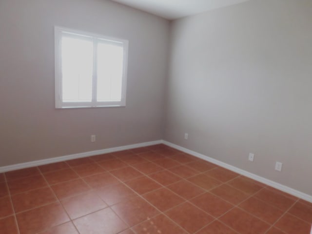 empty room featuring tile patterned flooring