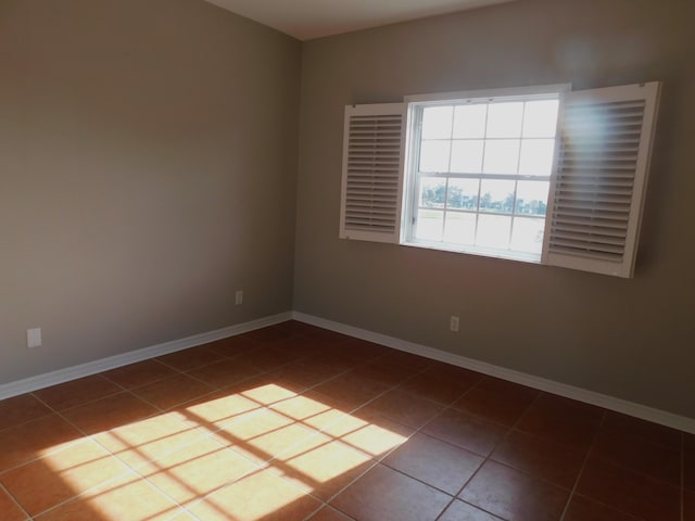 empty room featuring tile patterned floors