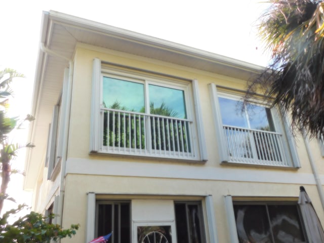 view of property exterior featuring a balcony