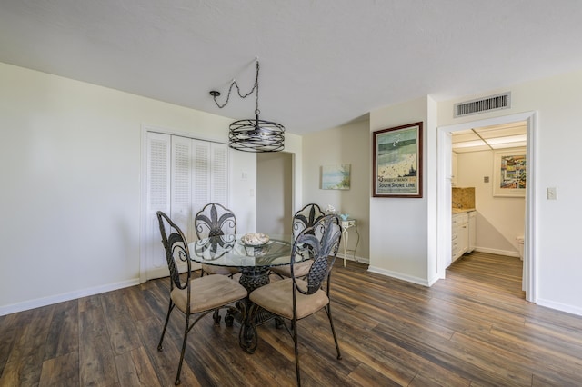 dining room featuring dark wood-type flooring