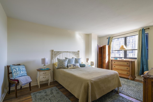 bedroom featuring dark hardwood / wood-style floors