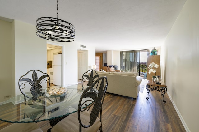 dining room with dark hardwood / wood-style floors