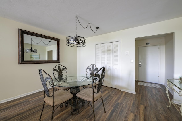 dining space with dark wood-type flooring