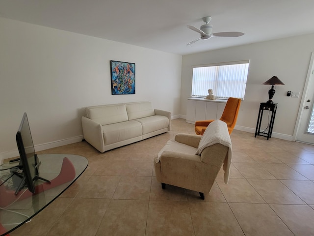 living room with ceiling fan and light tile patterned floors