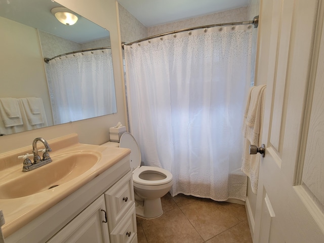 bathroom featuring toilet, vanity, and tile patterned floors