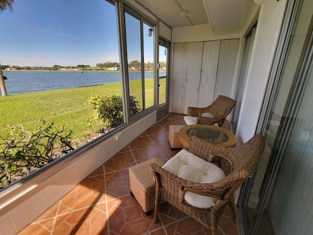 sunroom / solarium with a water view