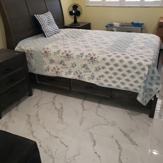 bedroom with marble finish floor