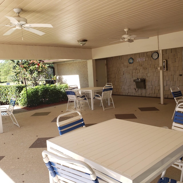 view of patio with ceiling fan and outdoor dining area