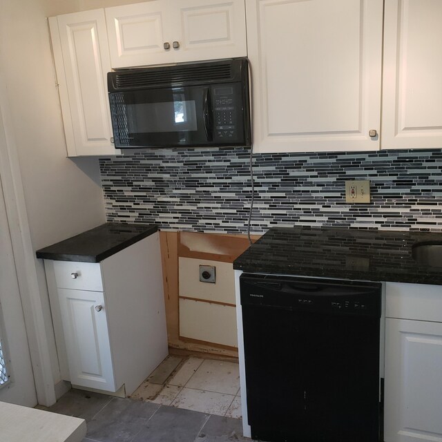 kitchen with tasteful backsplash, dark countertops, and baseboards