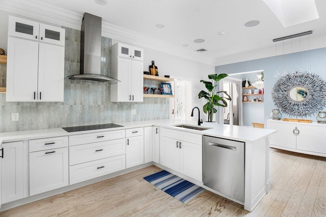 kitchen featuring dishwasher, white cabinetry, wall chimney range hood, sink, and black electric cooktop