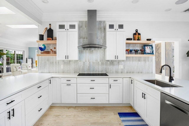 kitchen featuring white cabinetry, sink, wall chimney range hood, and stainless steel dishwasher