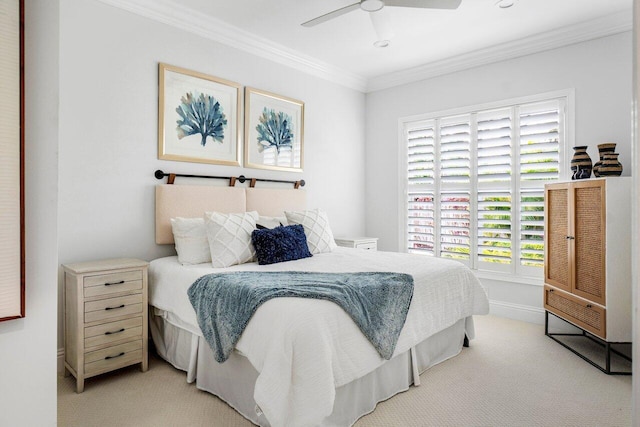 bedroom with ceiling fan, light colored carpet, and ornamental molding