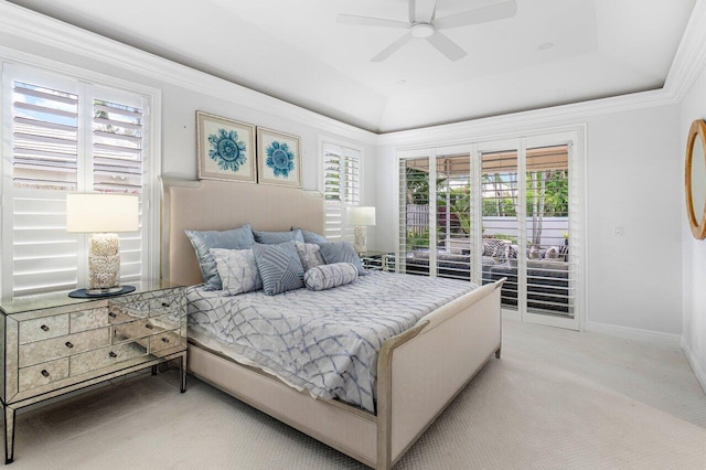 carpeted bedroom featuring access to outside, a raised ceiling, and ceiling fan